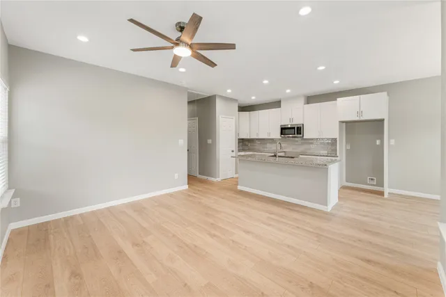 a view of kitchen with wooden floor