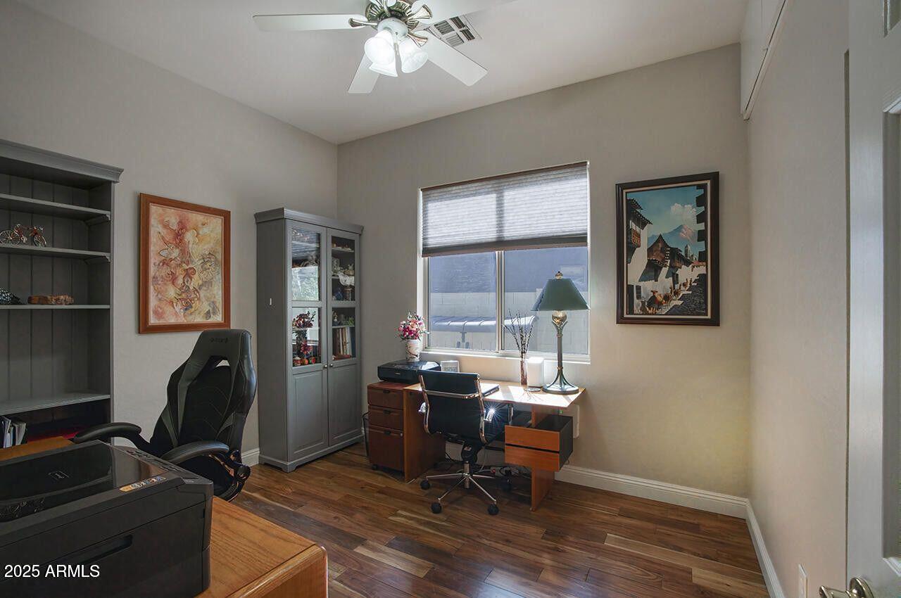 7726 South El Camino Drive Tempe, AZ 85284 - Photo 12 of 17 a view of a workspace with furniture and a window