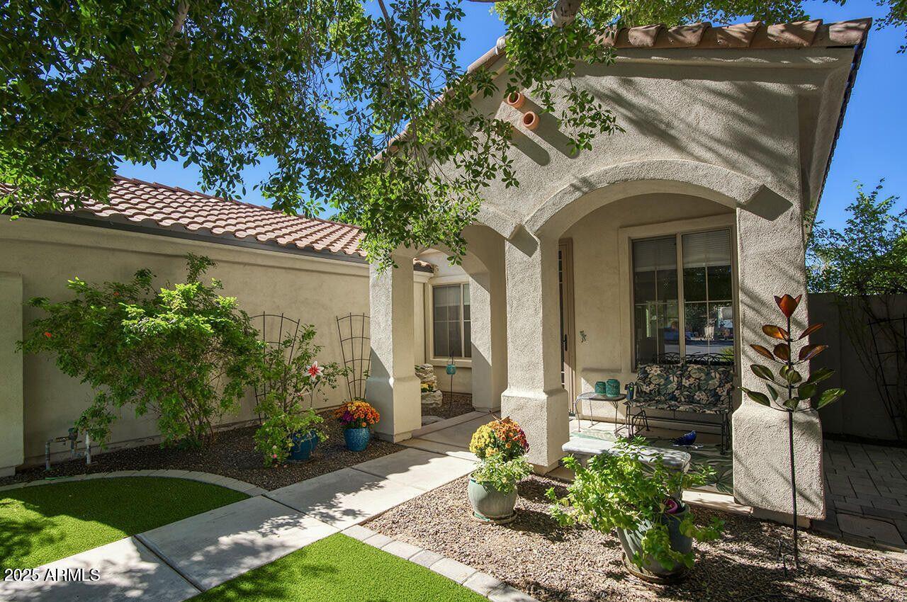 7726 South El Camino Drive Tempe, AZ 85284 - Photo 2 of 17 a front view of a house with garden