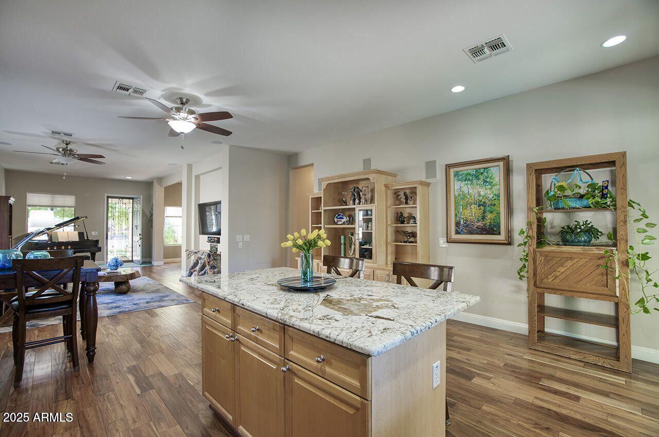 7726 South El Camino Drive Tempe, AZ 85284 - Photo 7 of 17 a kitchen with center island table and chairs