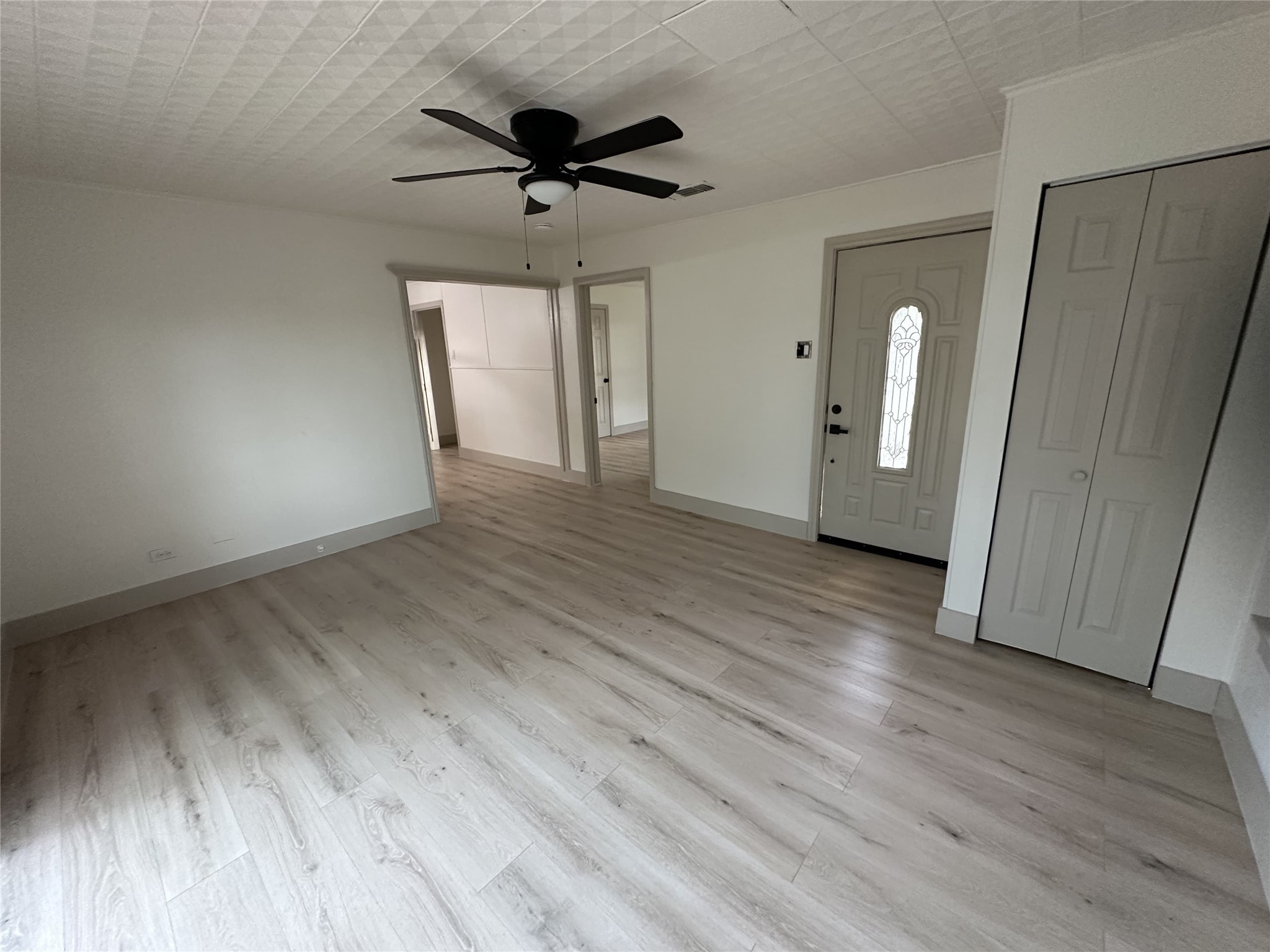 1747 5th Street Rosenberg, TX 77471 - Photo 4 of 10 wooden floor in an empty room with a window