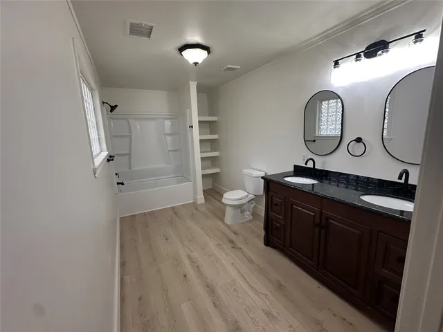 a bathroom with a sink and mirror