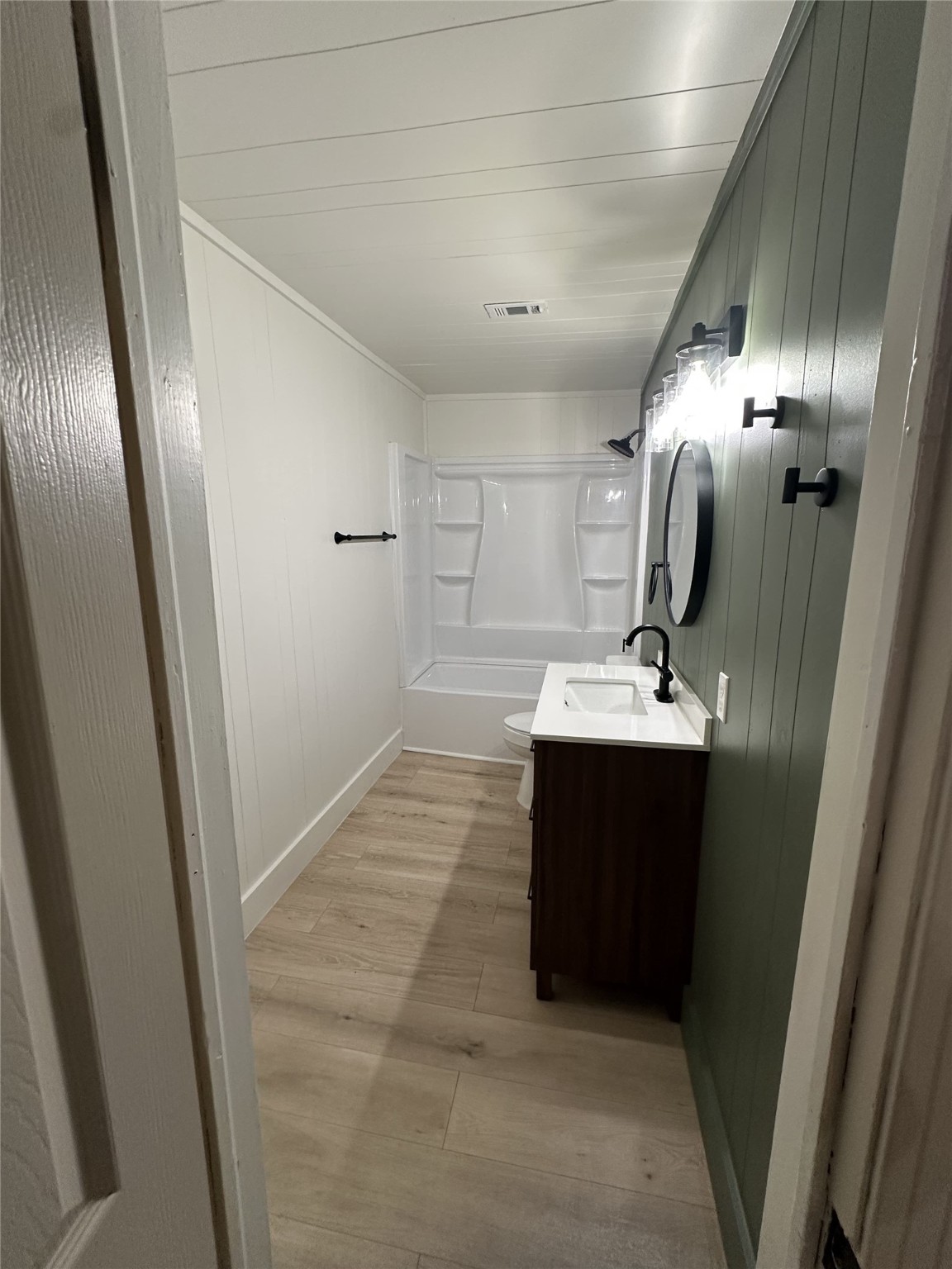 1747 5th Street Rosenberg, TX 77471 - Photo 9 of 10 a bathroom with a sink and mirror