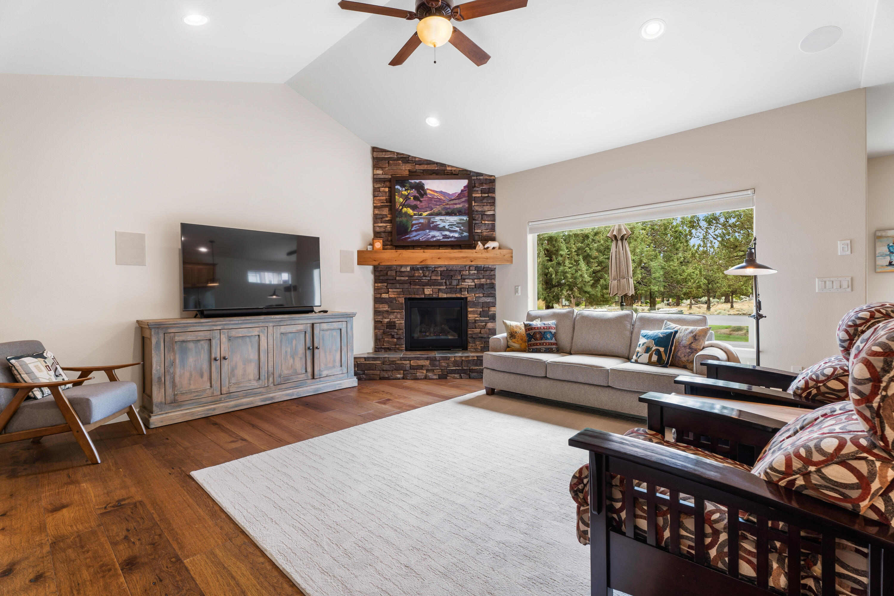 205 Vista Rim Drive Redmond, OR 97756 - Photo 6 of 85 a living room with furniture and a flat screen tv