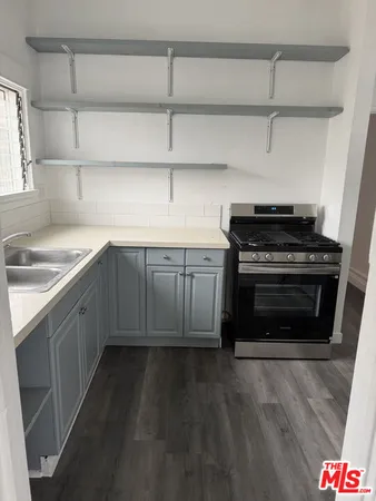 a kitchen with a stove and a sink