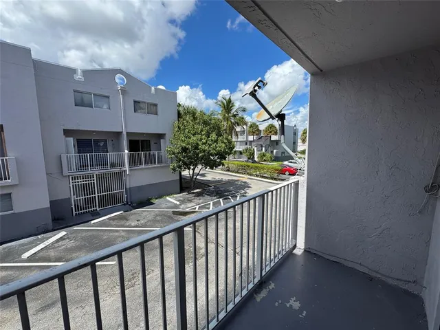 a view of balcony and wooden floor