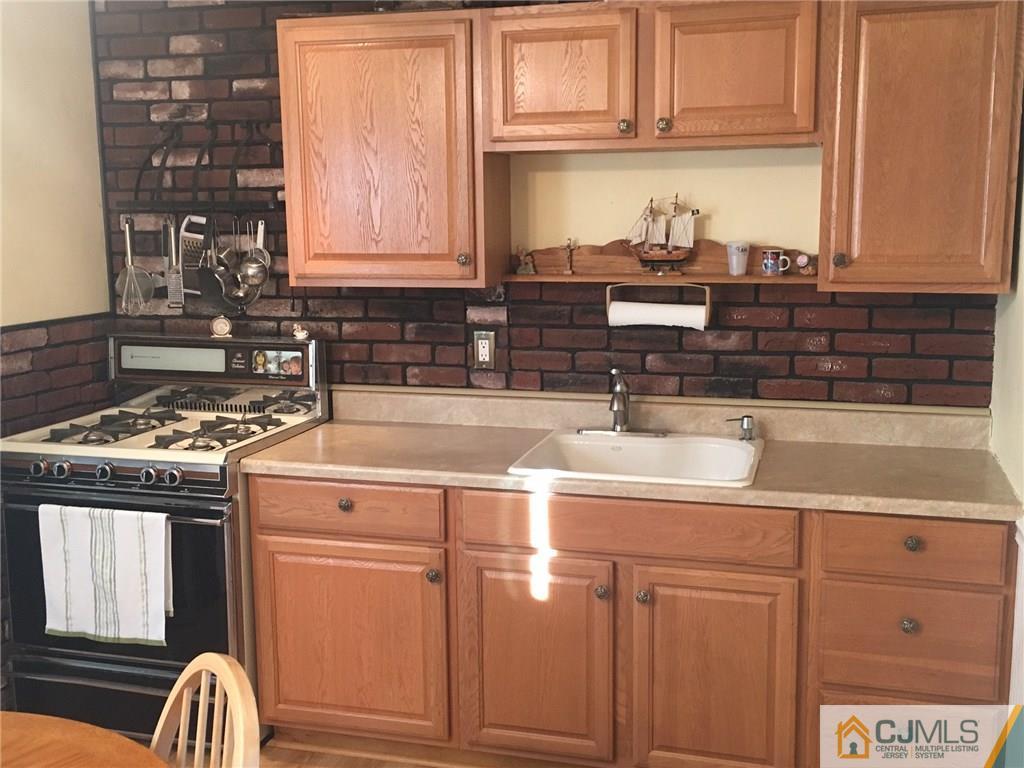 30 Altamont Road Edison, NJ 08817 - Photo 4 of 13 a kitchen with granite countertop a sink and a stove