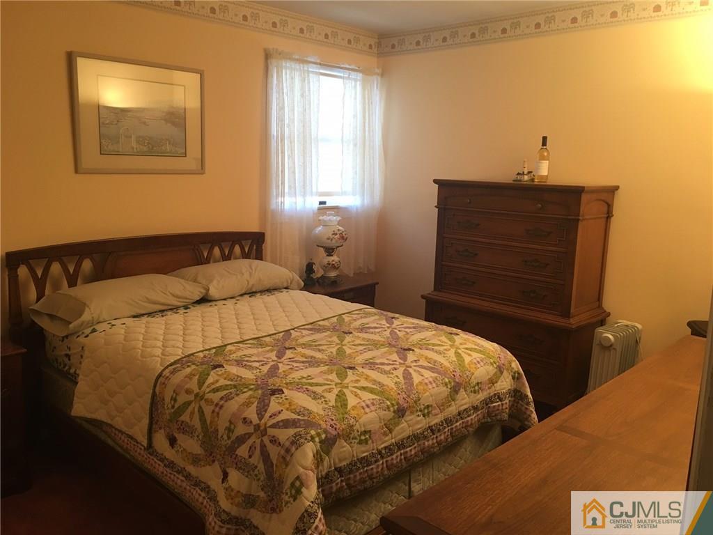 30 Altamont Road Edison, NJ 08817 - Photo 8 of 13 a bedroom with a bed and wooden floor