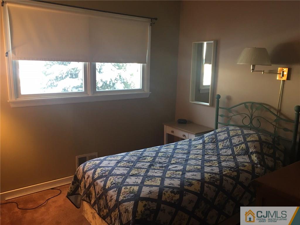 30 Altamont Road Edison, NJ 08817 - Photo 9 of 13 a bedroom with a bed and window