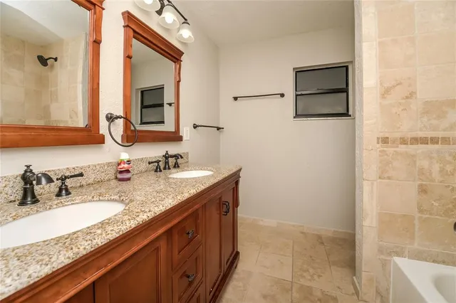 a house that has a tree in front of the house