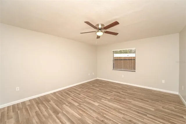 a bathroom with a sink mirror and shower