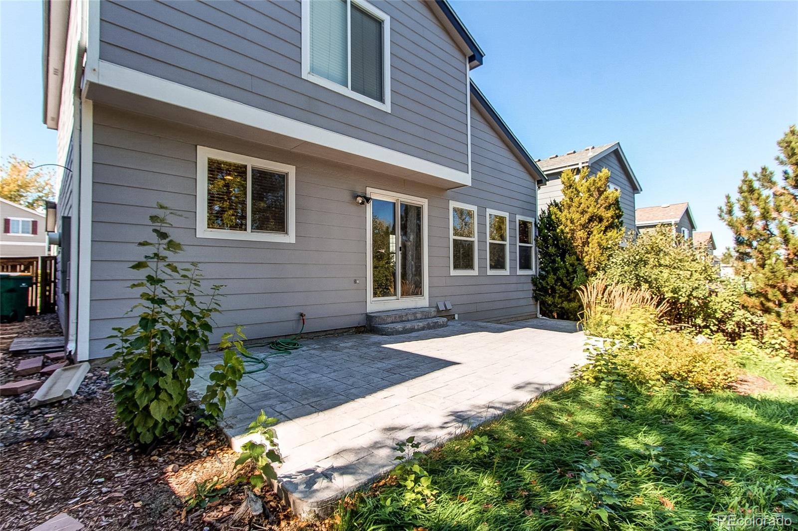 9776 Gatesbury Circle Highlands Ranch, CO 80126 - Photo 11 of 24 a view of a house with a yard