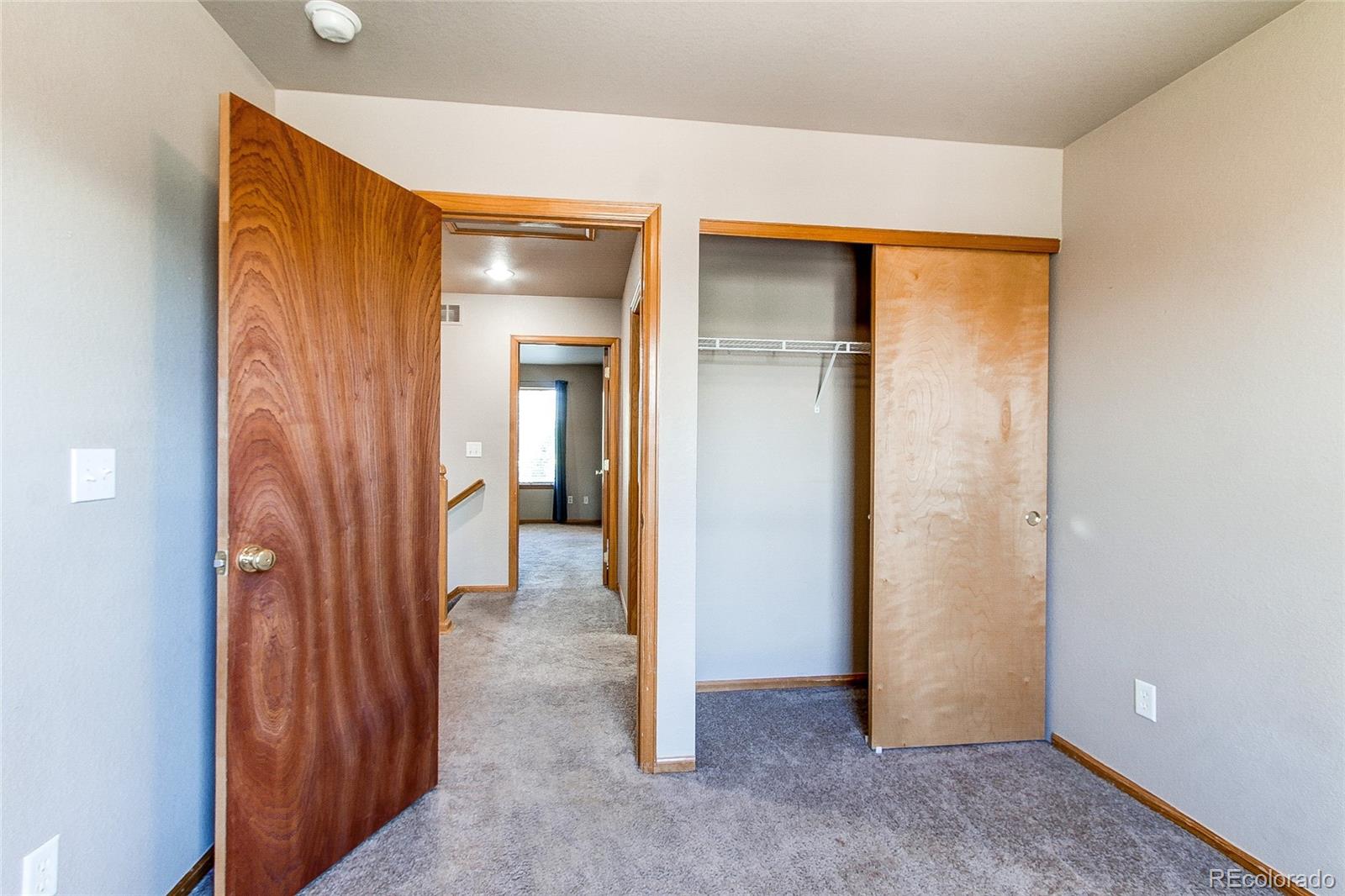 9776 Gatesbury Circle Highlands Ranch, CO 80126 - Photo 15 of 24 an empty room with closet and a bathroom