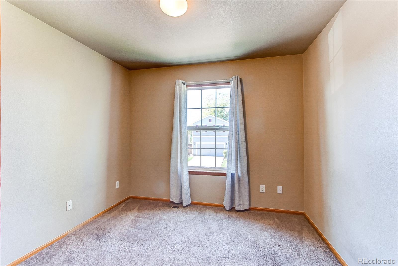 9776 Gatesbury Circle Highlands Ranch, CO 80126 - Photo 16 of 24 an empty room with window