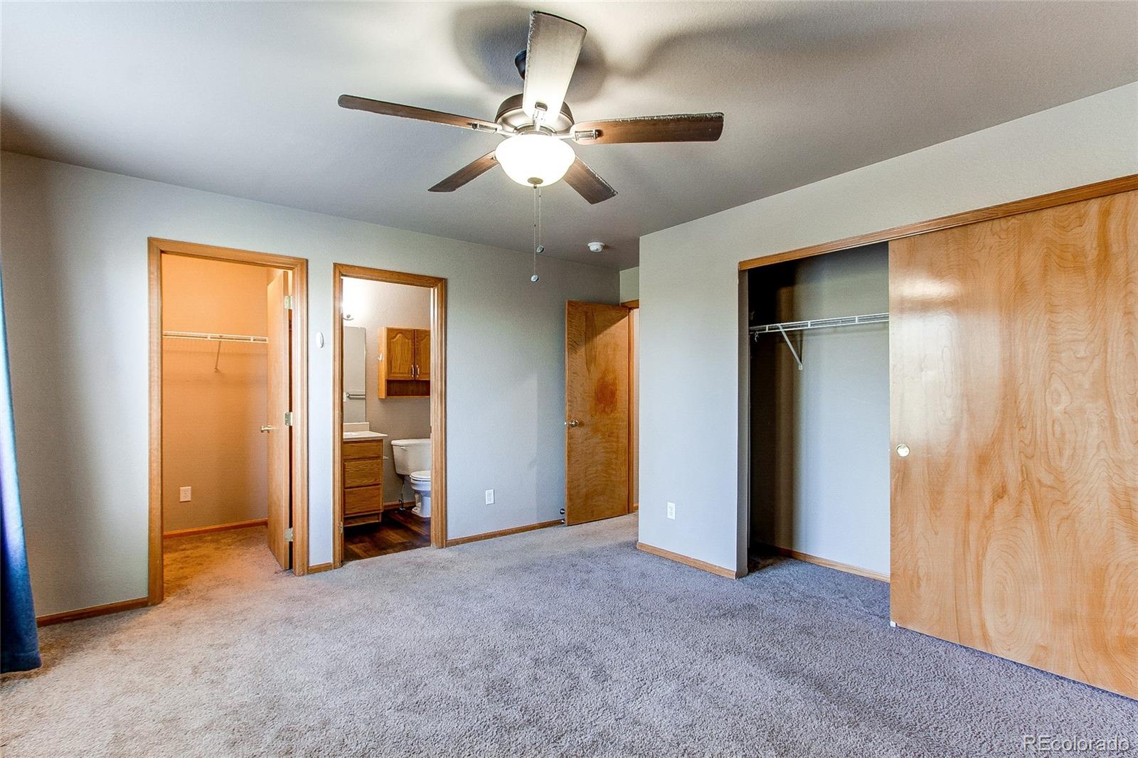 9776 Gatesbury Circle Highlands Ranch, CO 80126 - Photo 23 of 24 an empty room with closet and a ceiling fan