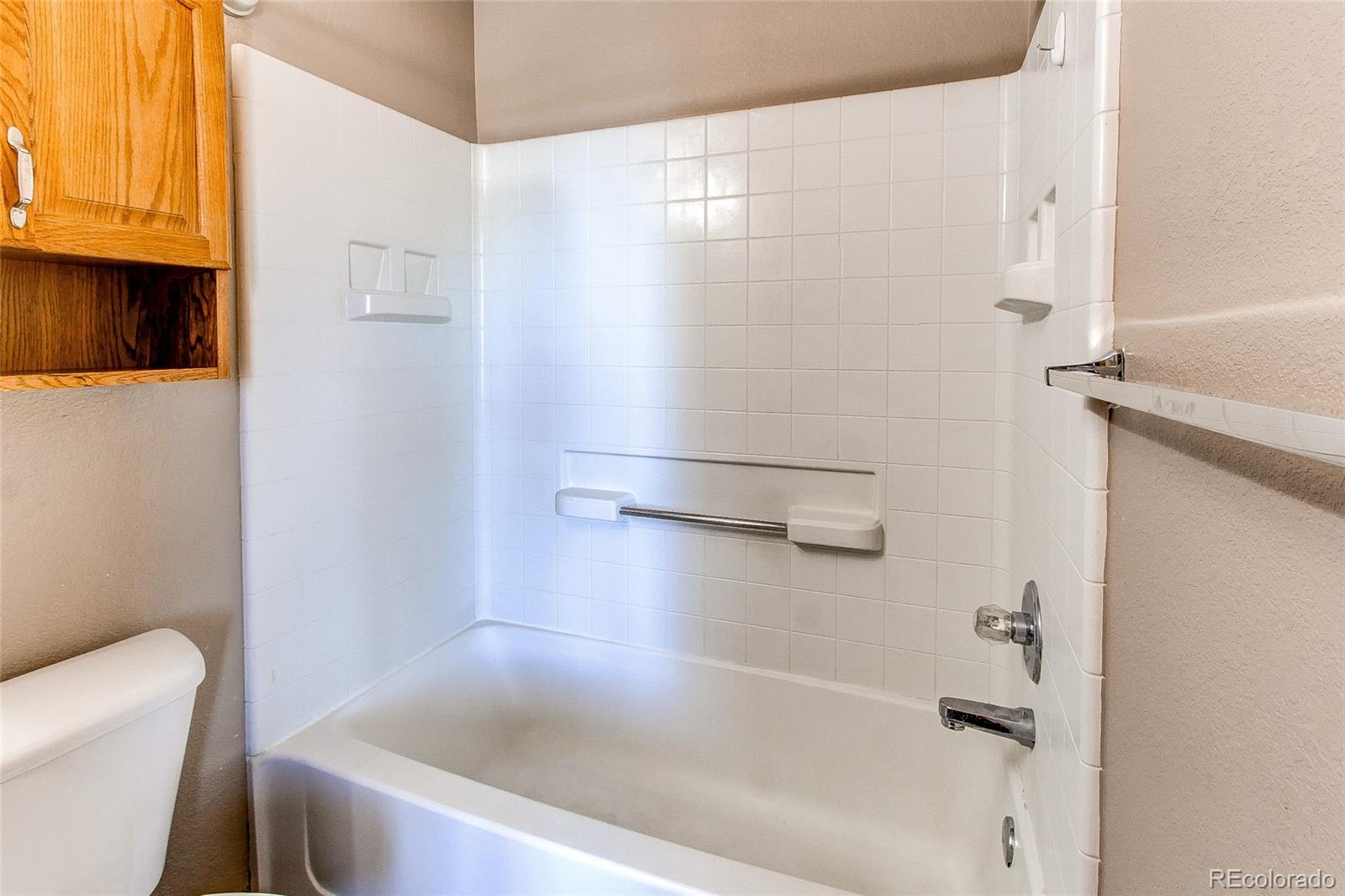 9776 Gatesbury Circle Highlands Ranch, CO 80126 - Photo 24 of 24 a bathroom with a bathtub and a toilet