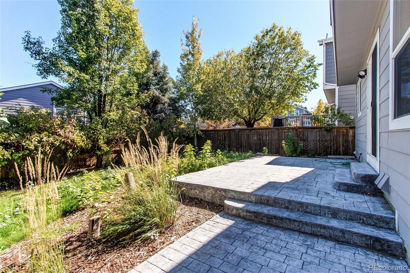 9776 Gatesbury Circle Highlands Ranch, CO 80126 - Photo 10 of 24 a view of a backyard