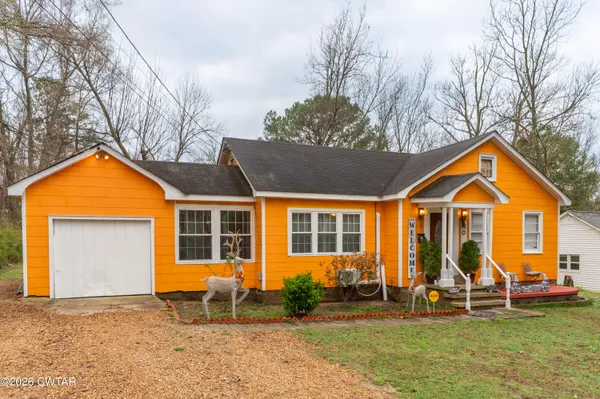 a view of a house with backyard porch and sitting area