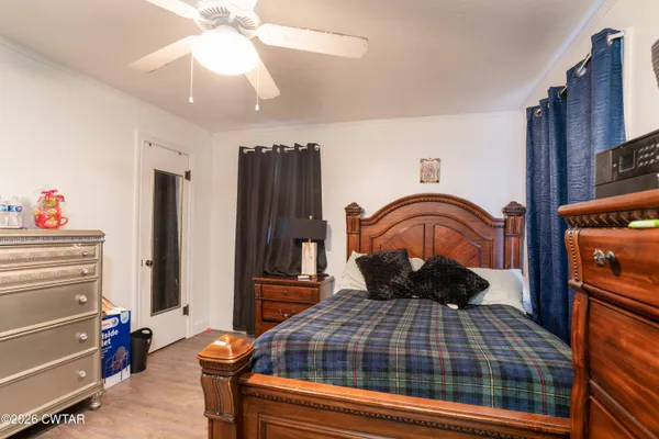 a bedroom with a bed and dresser