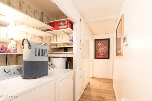 a bedroom with a bed and a mirror