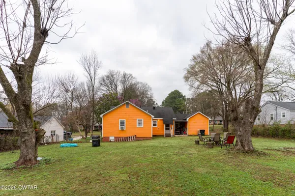 a front of a house with a yard and garage