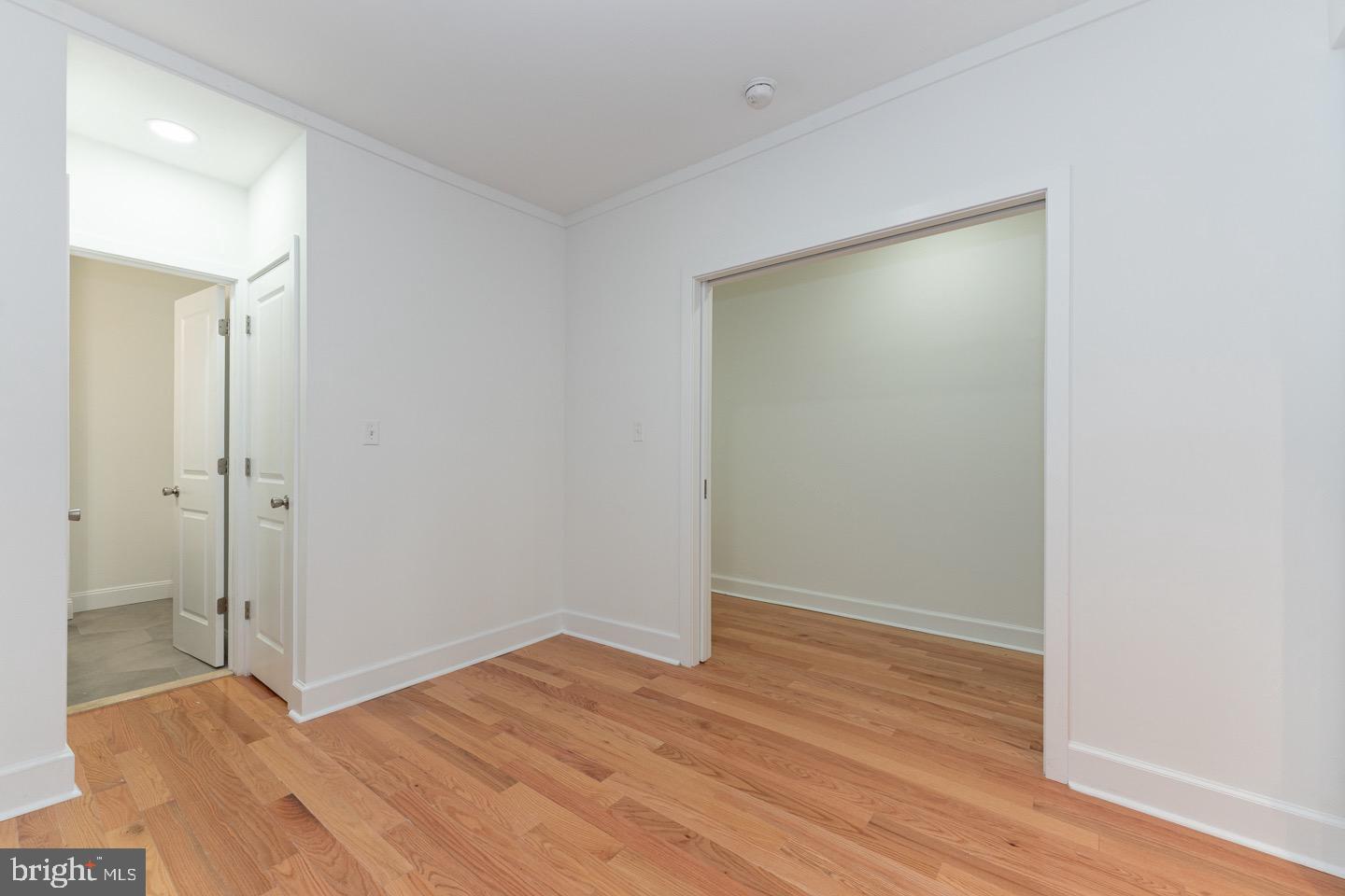 2118 Spruce Street, Unit 2R Philadelphia, PA 19103 - Photo 15 of 25 a big room with wooden floor and closet