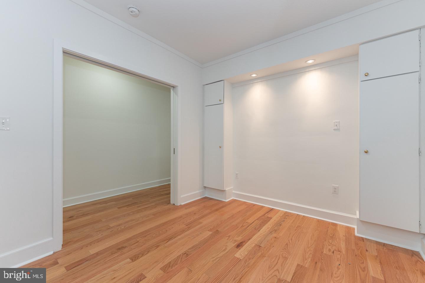 2118 Spruce Street, Unit 2R Philadelphia, PA 19103 - Photo 16 of 25 a view of an empty room with wooden floor