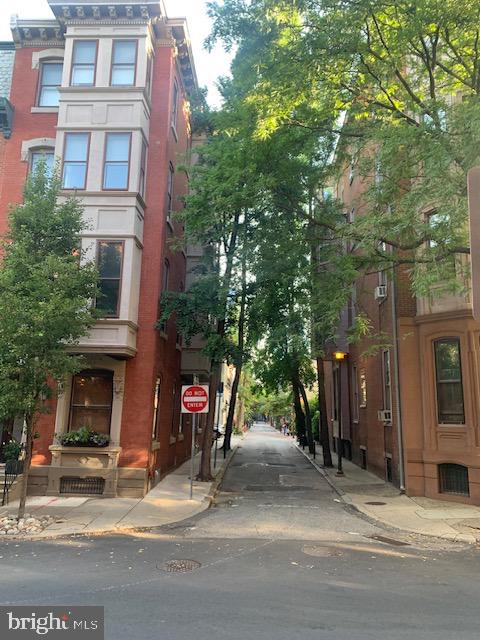 2118 Spruce Street, Unit 2R Philadelphia, PA 19103 - Photo 25 of 25 a view of a street with a building and a tree