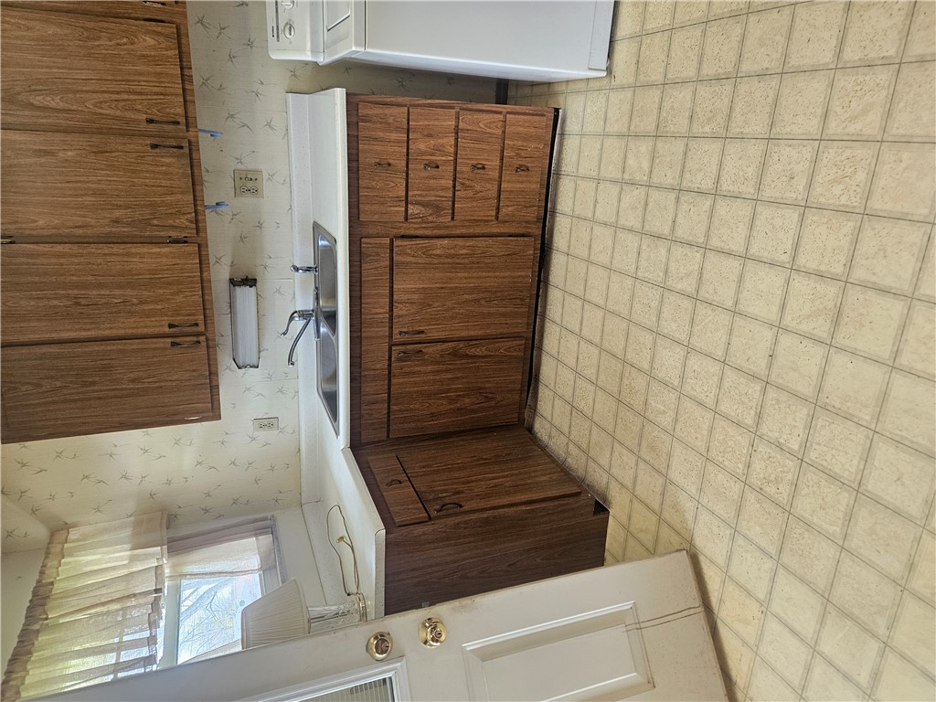 6510 Longford Road Dayton, OH 45424 - Photo 15 of 27 This efficient kitchen offers ample cabinetry, a double basin sink, and durable flooring.