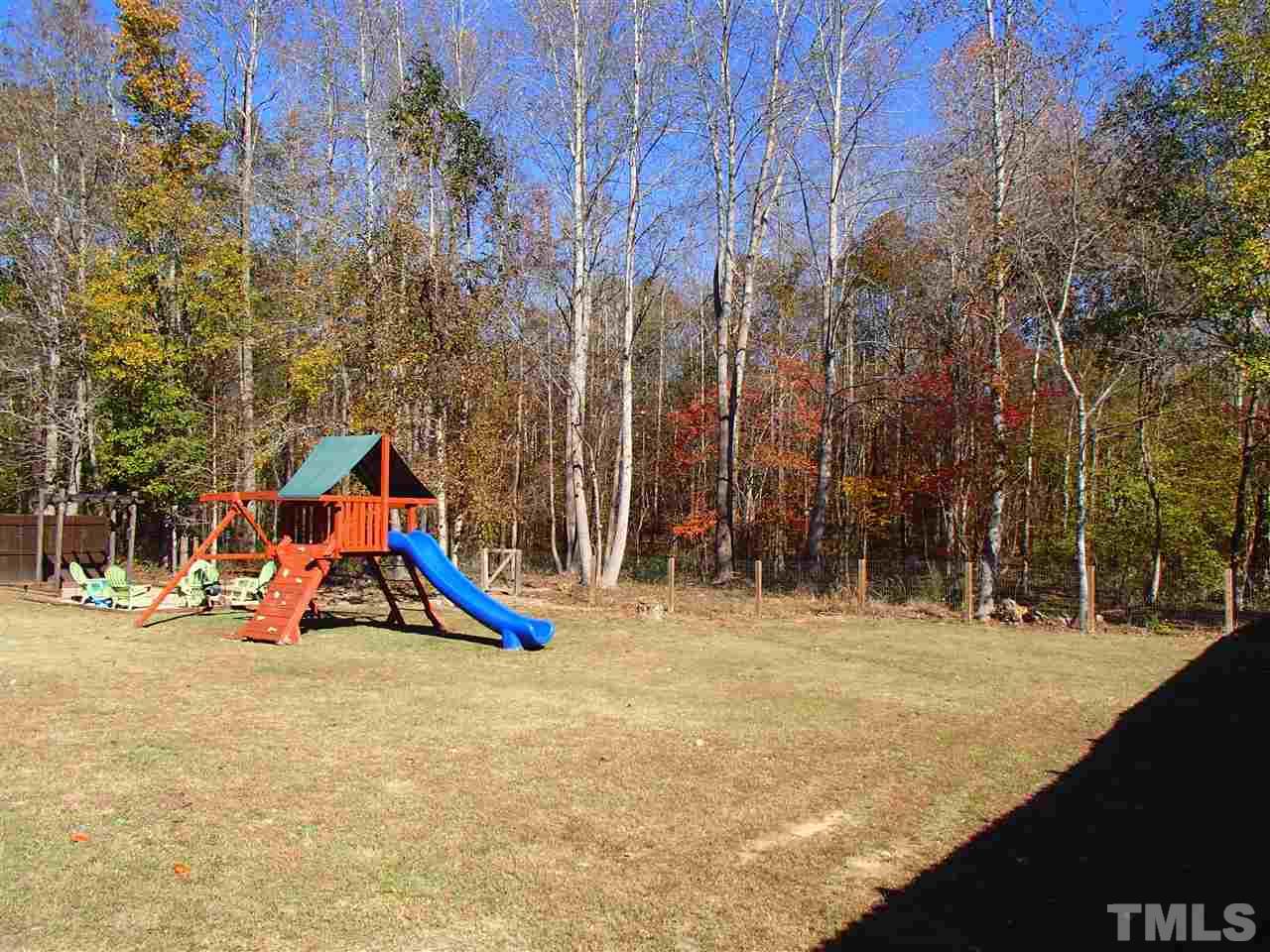 2183 Matthews Road Clayton, NC 27520 - Photo 6 of 25 Large fenced in back yard for hours of enjoyment. The rear of the lot is wooded and ensures privacy now and in the future.