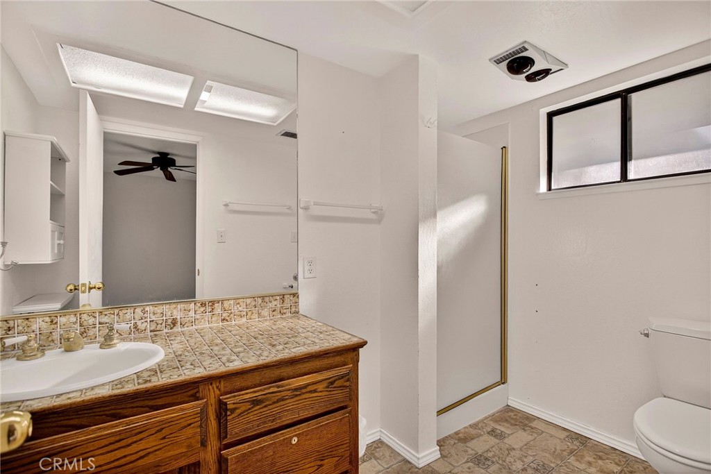 142 Honey Run Road Chico, CA 95928 - Photo 11 of 28 a bathroom with a granite countertop sink and a mirror