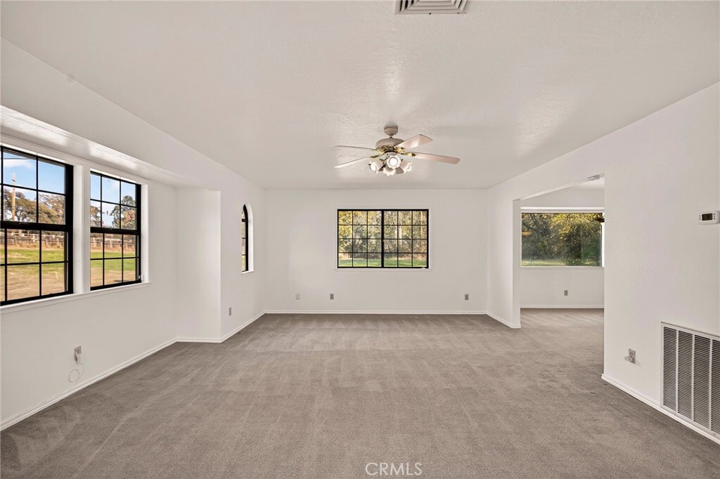 142 Honey Run Road Chico, CA 95928 - Photo 4 of 28 a view of an empty room with a window