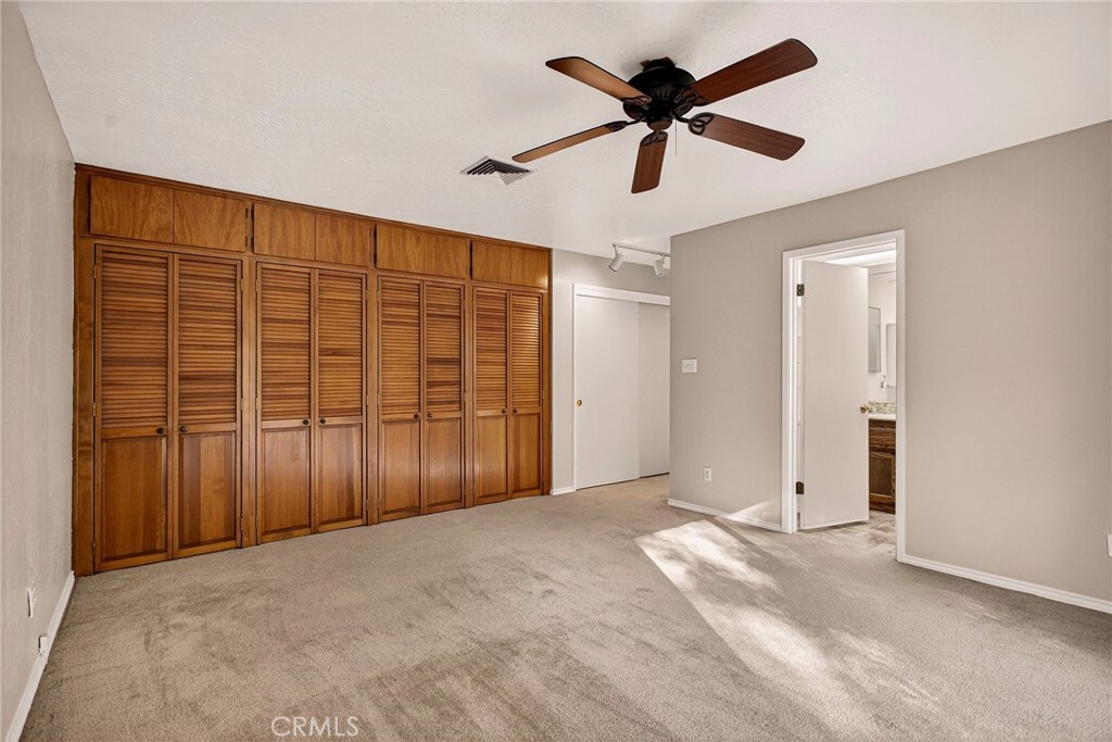 142 Honey Run Road Chico, CA 95928 - Photo 9 of 28 an empty room with ceiling fan and window