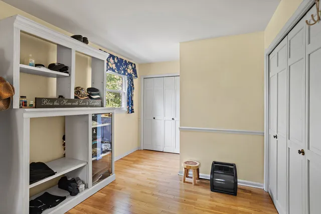 a view of room with cabinet and mirror