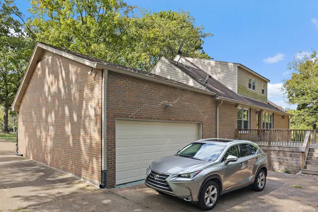 a view of a house with a wooden deck