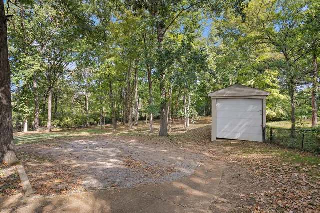 a backyard of a house with lots of green space