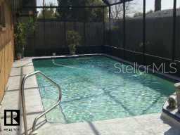 8653 Sabal Way Port Richey, FL 34668 - Photo 2 of 3 a backyard of a house