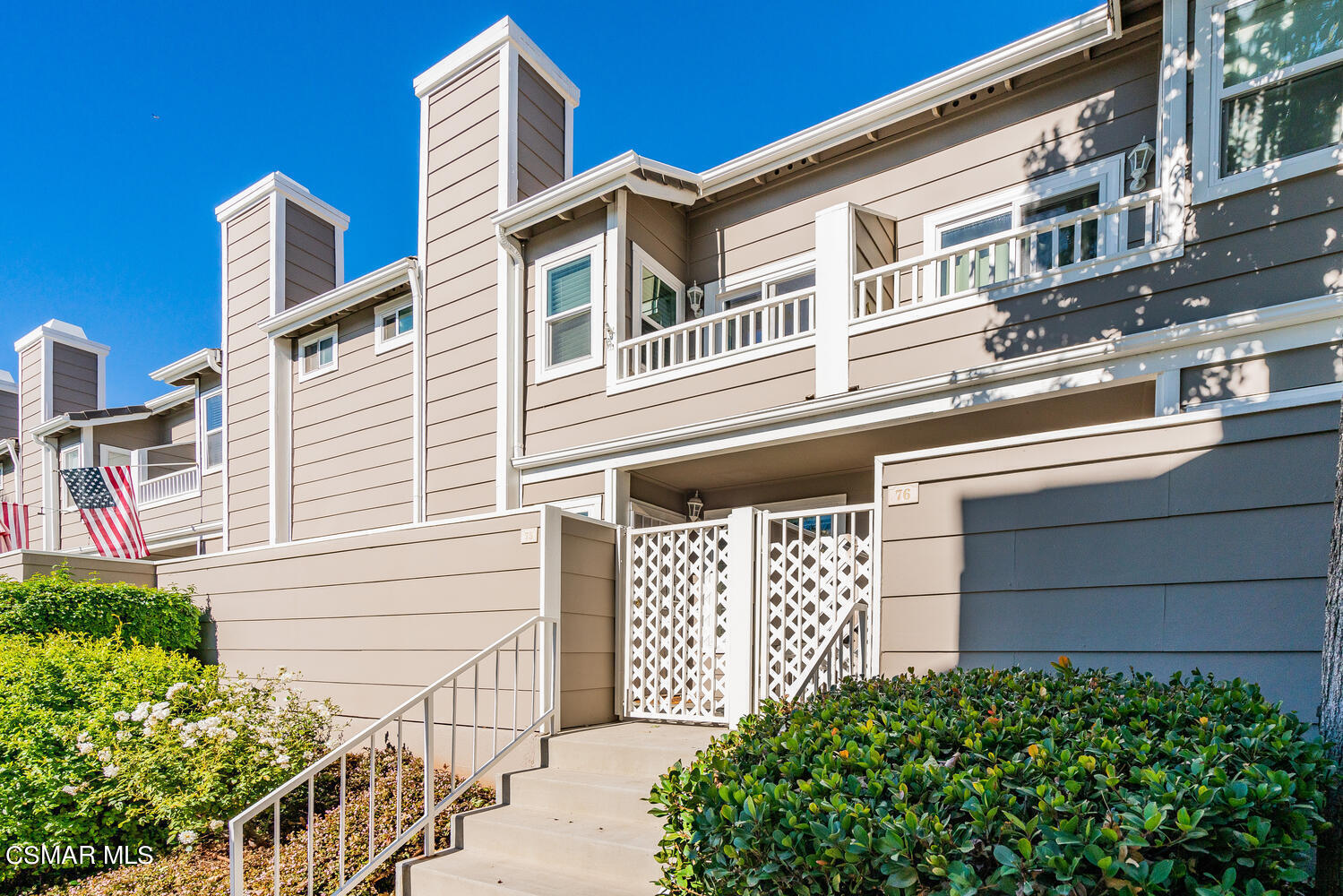 3966 Cochran Street, Unit 75 Simi Valley, CA 93063 - Photo 1 of 21 a front view of a house with a garden