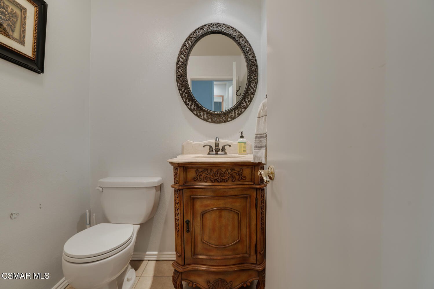 3966 Cochran Street, Unit 75 Simi Valley, CA 93063 - Photo 14 of 21 a bathroom with a toilet a sink and a mirror