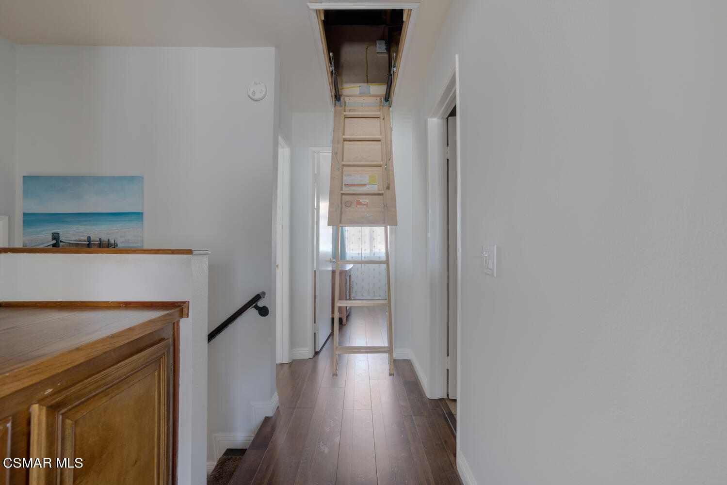 3966 Cochran Street, Unit 75 Simi Valley, CA 93063 - Photo 18 of 21 a view of a hallway with wooden floor and staircase