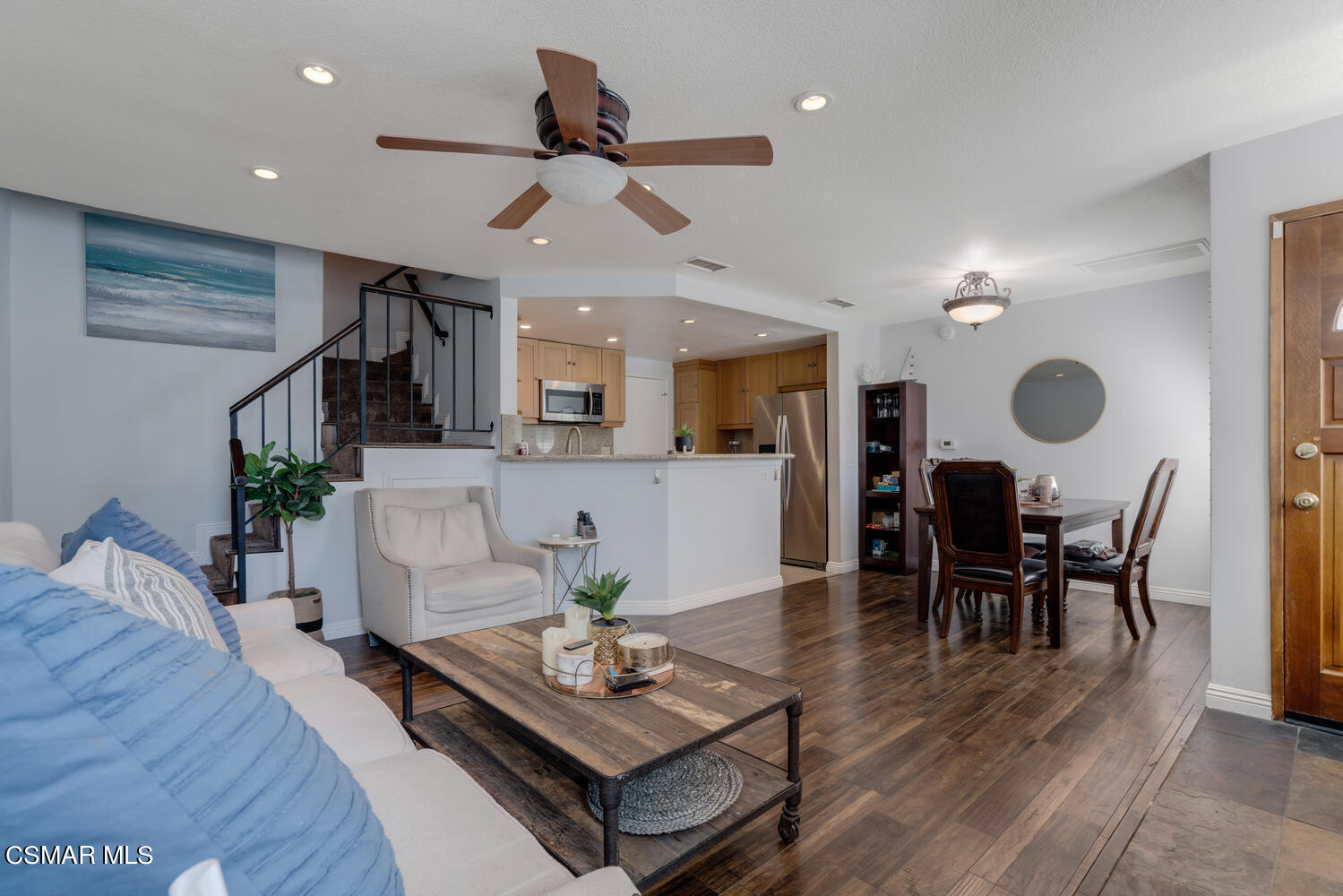 3966 Cochran Street, Unit 75 Simi Valley, CA 93063 - Photo 3 of 21 a living room with furniture kitchen view and a wooden floor
