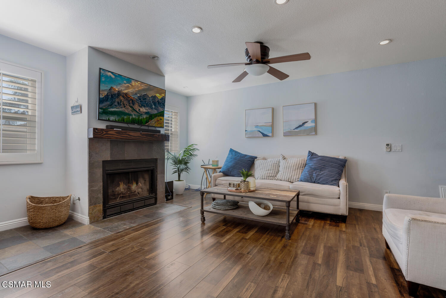 3966 Cochran Street, Unit 75 Simi Valley, CA 93063 - Photo 4 of 21 a living room with furniture and a fireplace