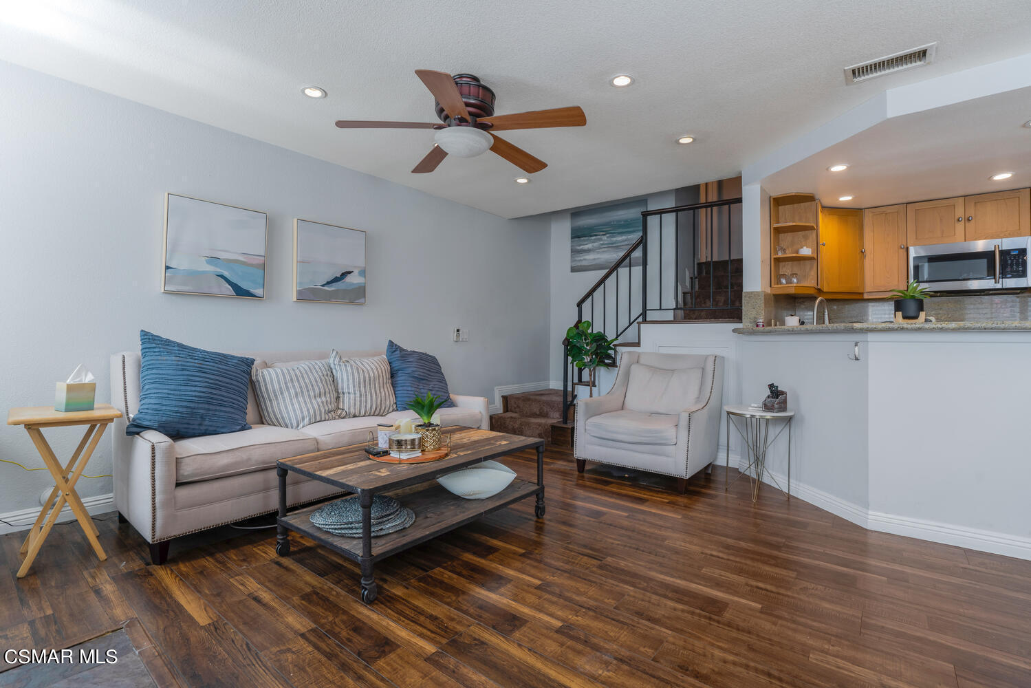 3966 Cochran Street, Unit 75 Simi Valley, CA 93063 - Photo 5 of 21 a living room with furniture and a view of kitchen
