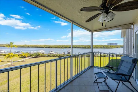 a view of a chairs and table in the balcony