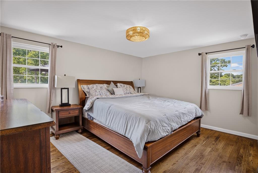 272 Hays Road Pittsburgh, PA 15241 - Photo 16 of 43 Spacious primary bedroom suite featuring hardwood floors, generous wall space, and large windows for natural light.