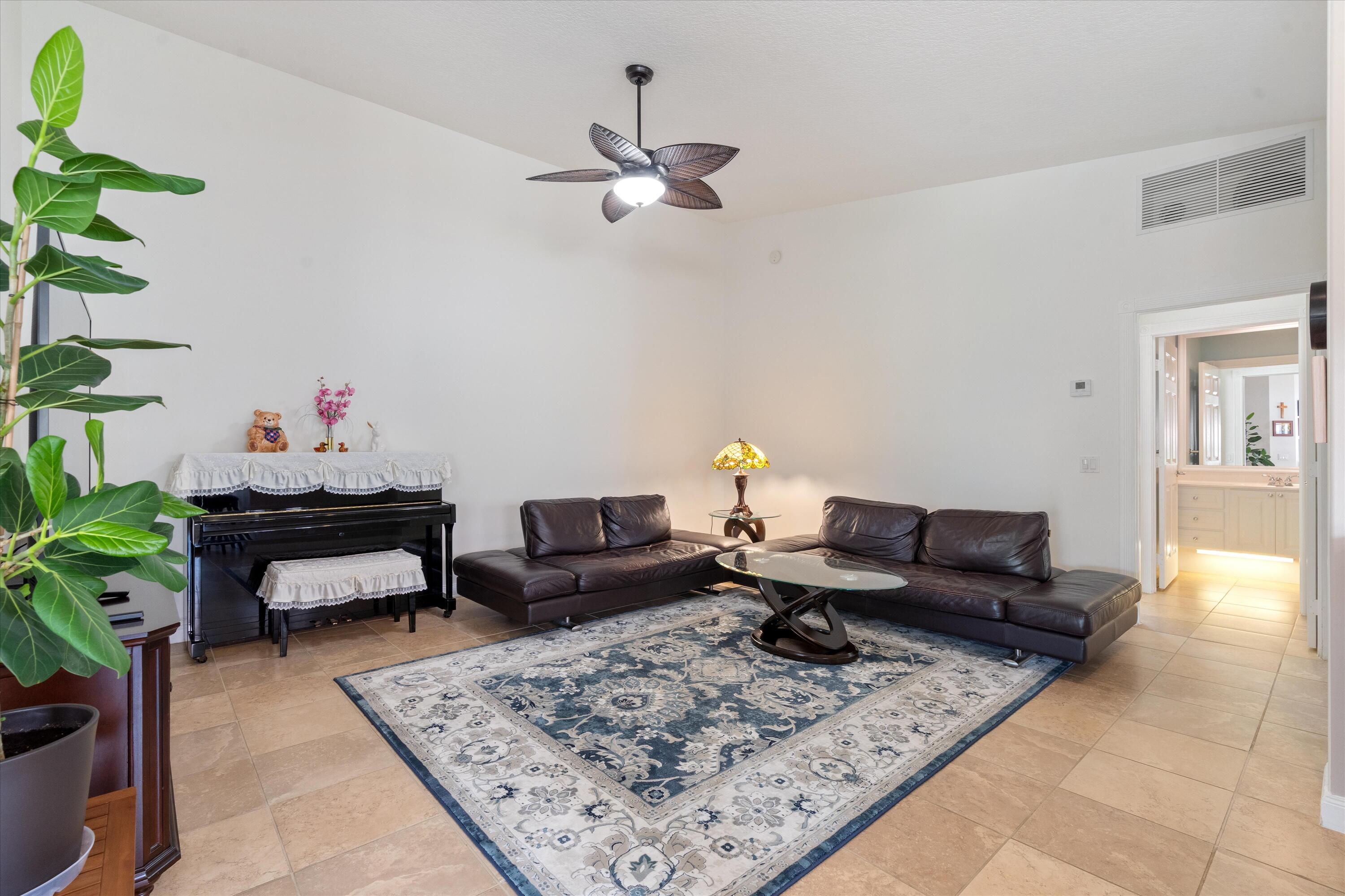 8255 Quito Place Wellington, FL 33414 - Photo 11 of 23 a living room with furniture and a rug
