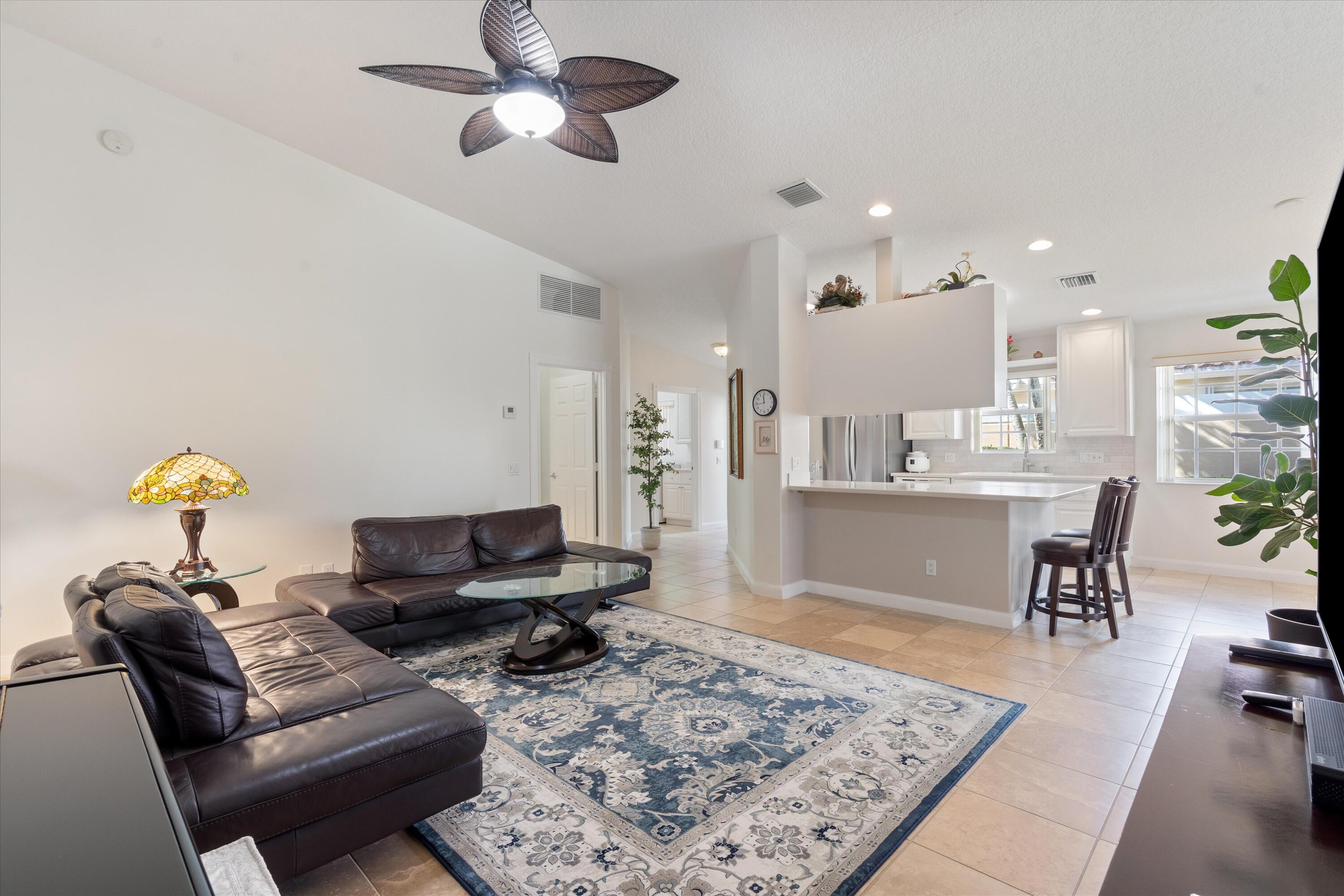 8255 Quito Place Wellington, FL 33414 - Photo 12 of 23 a living room with furniture and a rug