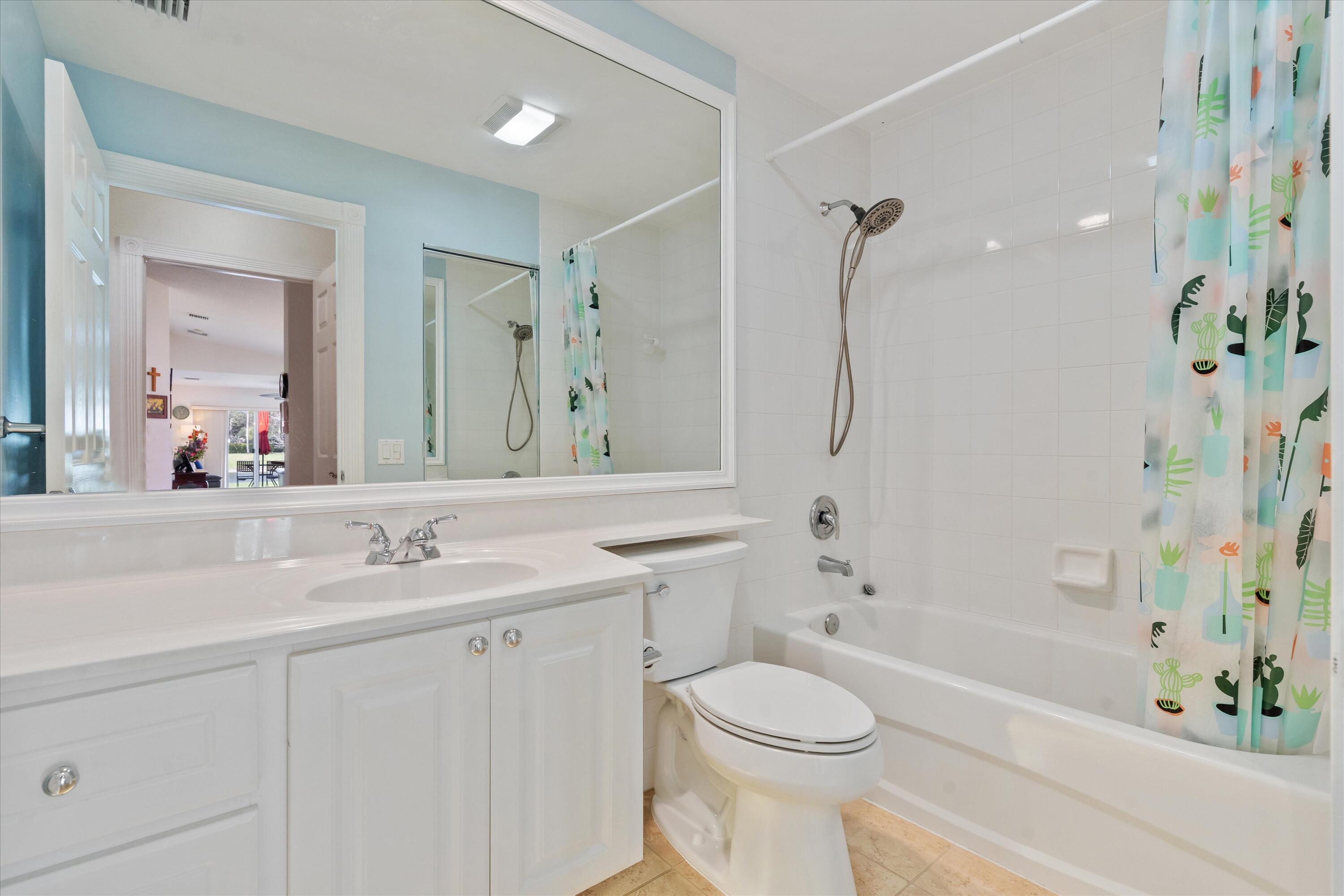 8255 Quito Place Wellington, FL 33414 - Photo 18 of 23 a bathroom with a sink a toilet and shower