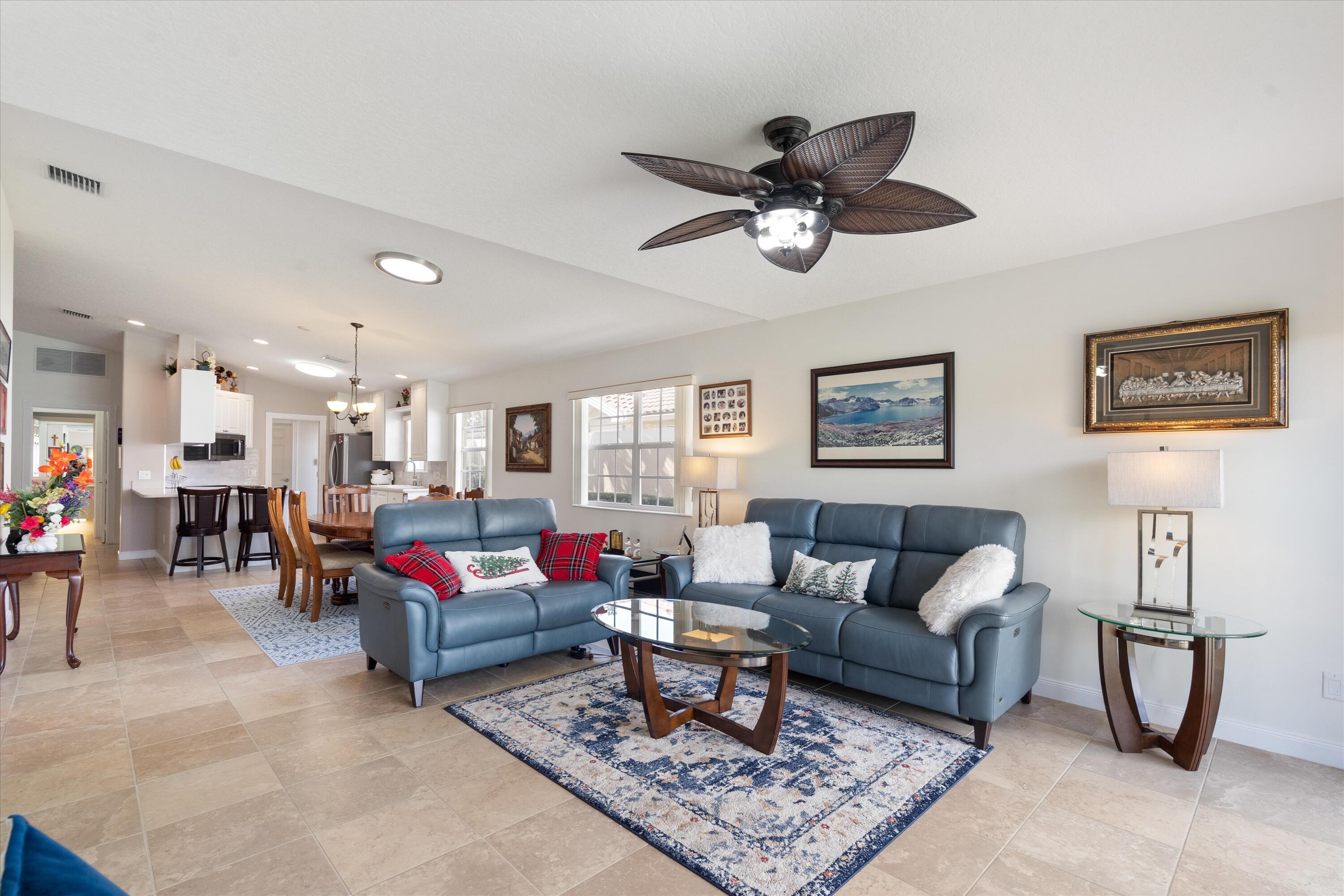 8255 Quito Place Wellington, FL 33414 - Photo 5 of 23 a living room with furniture and kitchen view
