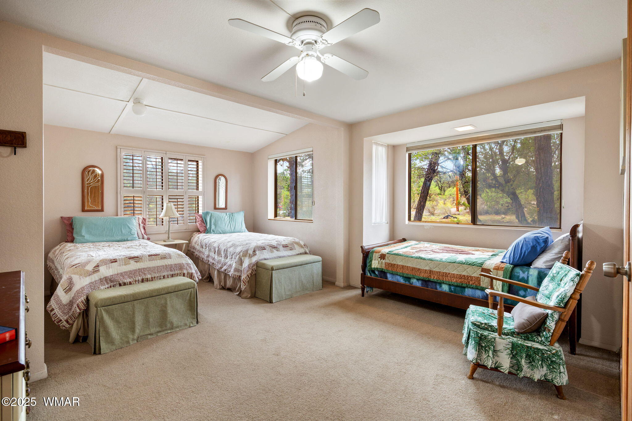 3154 Aspen Road Overgaard, AZ 85933 - Photo 21 of 36 a bedroom with a bed and a couch